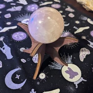 Elegant Rose Quartz Sphere on Wooden Stand
